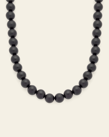 Hero Image of the 15mm Dark Boulé Necklace on a cream background.