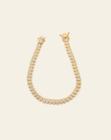 Oval bezel cubic zirconia tennis bracelet in gold vermeil with an open box clasp 