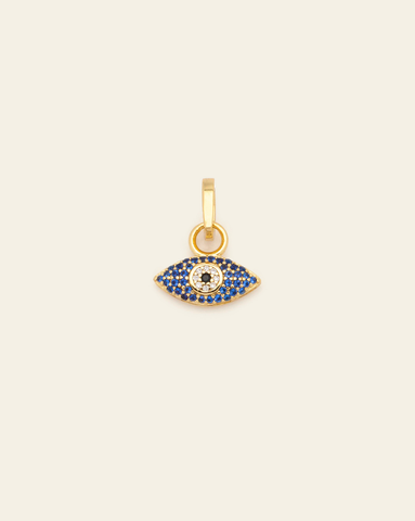Product shot of the Azure Evil Eye Charm in gold vermeil with blue and white pavé stones on neutral background.