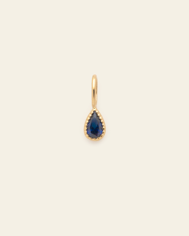 10k solid gold blue sapphire birthstone pendant charm with teardrop faceted blue gemstone in a minimalist fine jewelry design