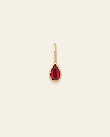 10k solid gold ruby birthstone pendant charm with teardrop faceted red gemstone in a minimalist fine jewelry design