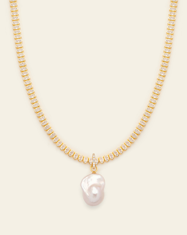 Oval bezel cubic zirconia tennis necklace with a pave clasp and a large seed pearl pendant in gold vermeil 