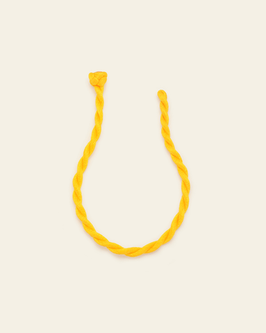 Lemon yellow twisted cord bracelet with knotted closure, displayed in a soft curve on a neutral background.