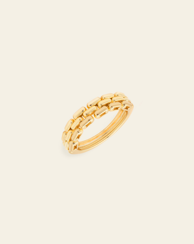 Hero image - Gold vermeil chain link ring with modern stacked design on a cream background.