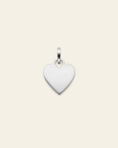 Sterling Silver Heart Charm with a polished surface, designed for engraving and layering on necklaces or bracelets.