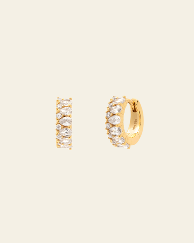 Gold huggie hoop earrings with pear shaped cubic zirconia and round crystal accents