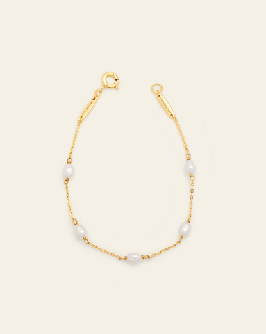 Product image of gold vermeil chain bracelet with evenly spaced freshwater pearls on a neutral background.