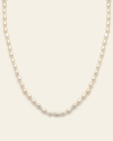 Product image of full freshwater pearl necklace with uniform oval pearls on neutral background.