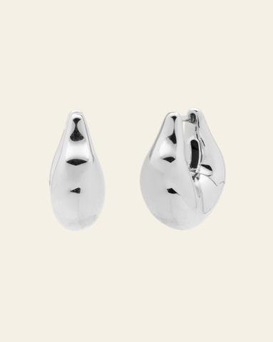 Silver chunky hoop earrings with sculptural wave design and high-polish finish - bold statement jewelry.
