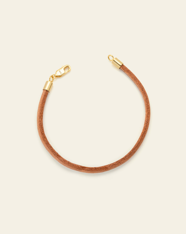 Hero Image of the Smooth Leather Bracelet with a gold vermeil clasp on a white background.