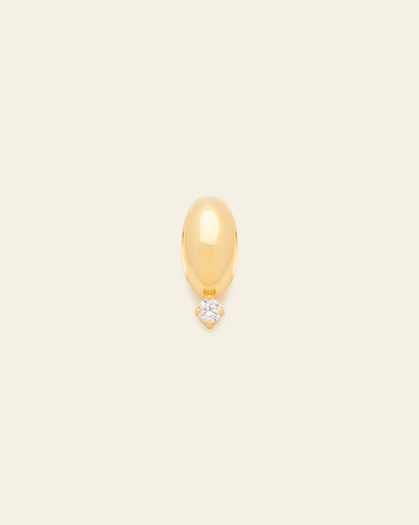 Polished gold bead spacer charm with a single dangling CZ stone, displayed against a neutral background.