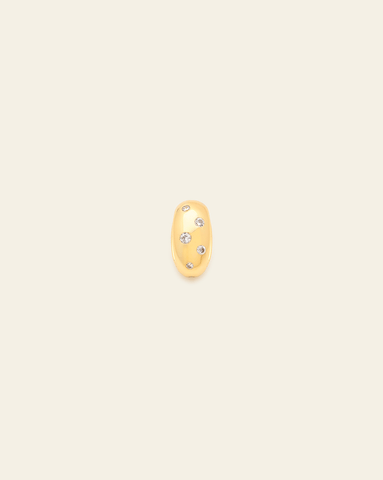 Gold bead spacer charm with scattered CZ stones embedded in an organic pattern, displayed against a neutral background.