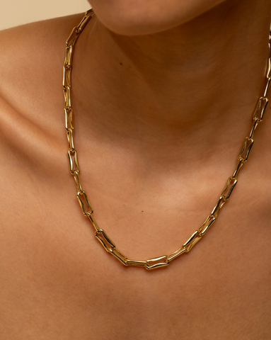Gold-plated mini-rectangle link necklace on model.